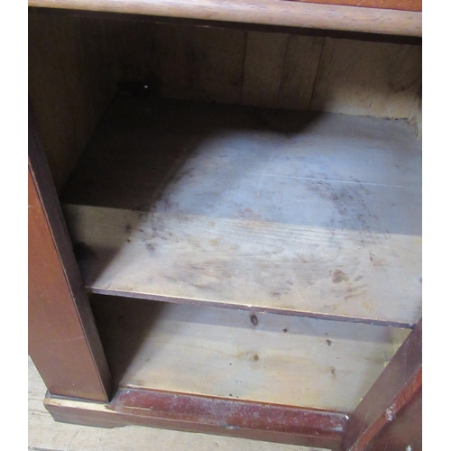 12 - A Victorian mahogany wash stand/desk, with sloping hinged lid, fitted with a cupboard