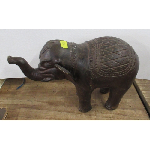 147 - A pottery model, of a walrus, height 9.5ins, length 14ins, together with two metal models