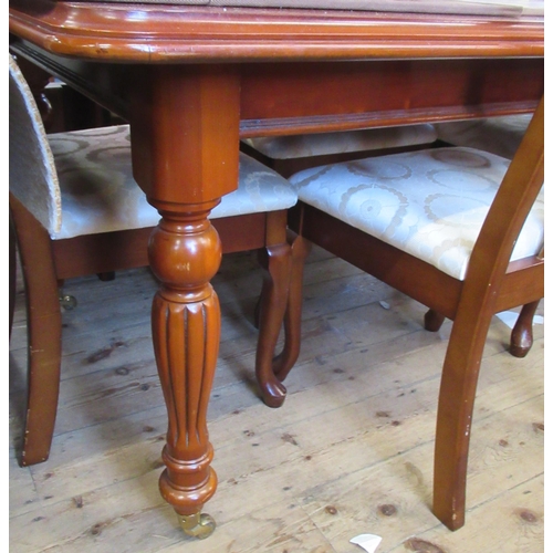 15 - A reproduction extending dining table, and 8 chairs