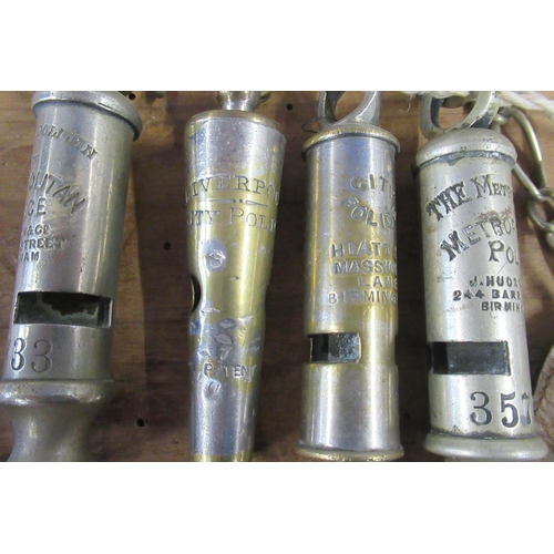 161 - Two Metropolitan Police whistles, together with a City Police whistle and a Liverpool City Police wh... 