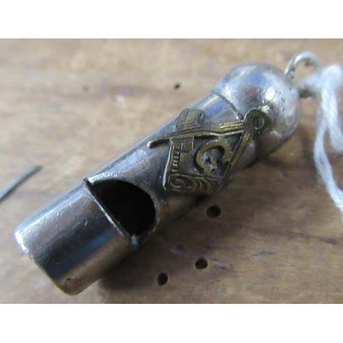 165 - A small whistle, with Masonic cypher