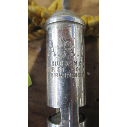 166 - Two Hudson & Co Birmingham ARP whistles, together with an Aide Bros. Birmingham whistle