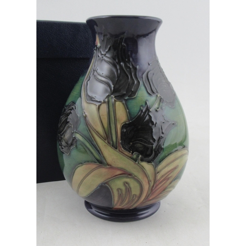 188 - A Moorcroft pottery baluster vase, decorated in the Black Tulip pattern, height 7.5ins