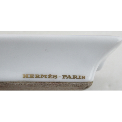 191 - A boxed set of four Hermes porcelain ashtrays, printed with racehorses, together with another boxed ... 