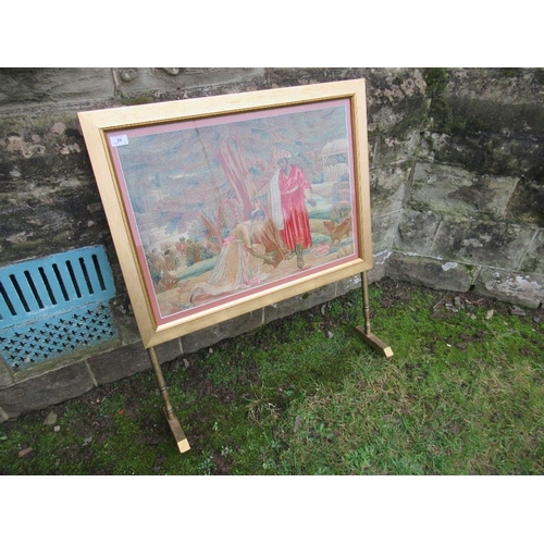 2 - A fire screen with tapestry panels of figures and  a dog, height 38ins, width 31ins