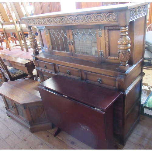 22 - A 20th century court cupboard, together with a tv stand and a modern drop leaf table