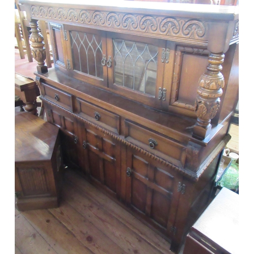 22 - A 20th century court cupboard, together with a tv stand and a modern drop leaf table