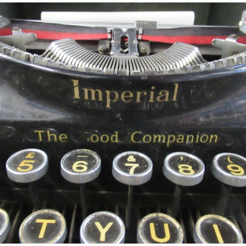 237 - A cased Imperial type writer