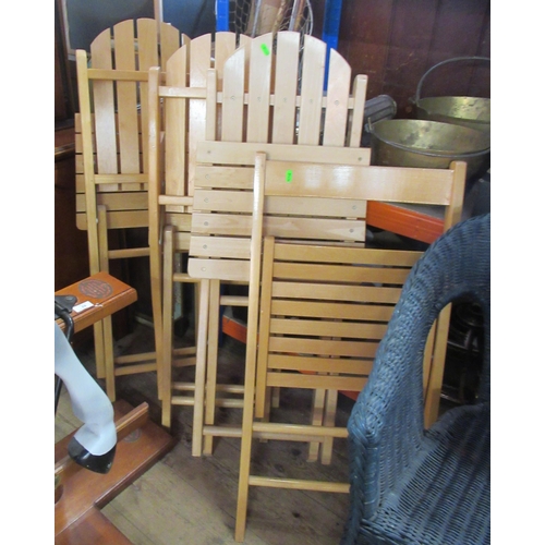 25 - Two wicker chairs, together with 4 folding chairs