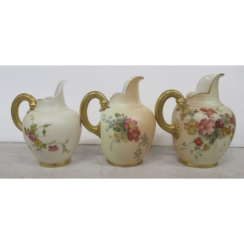 254 - Three Royal Worcester blush ivory flat back jugs, decorated with floral sprays, shape number 1094, o... 