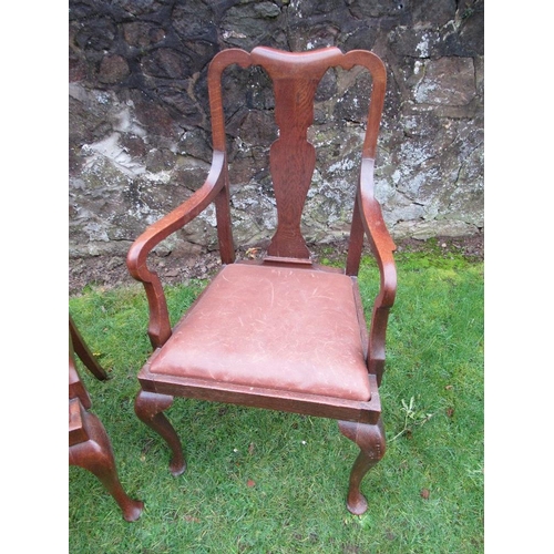 26 - A pair of oak open armchairs