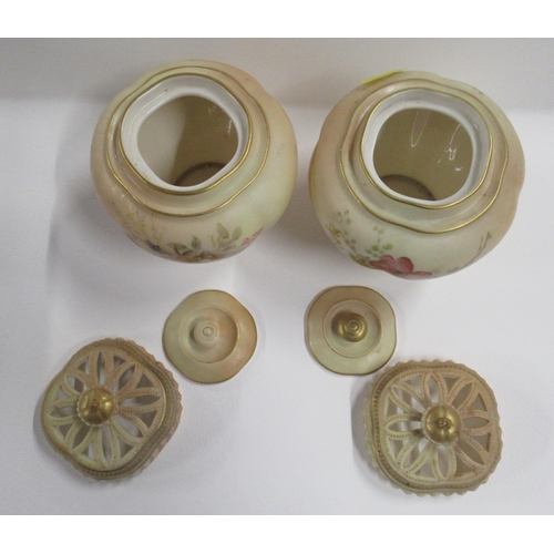 260 - A pair of Royal Worcester blush ivory covered vases, decorated with floral sprays, with inner covers... 