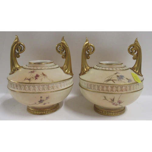 266 - A pair of Royal Worcester blush ivory vases, decorated with floral sprays, with Edward Raby monogram... 