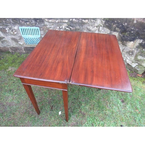 27 - A 19th century mahogany fold over card table