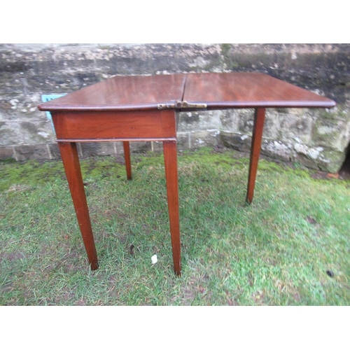 27 - A 19th century mahogany fold over card table