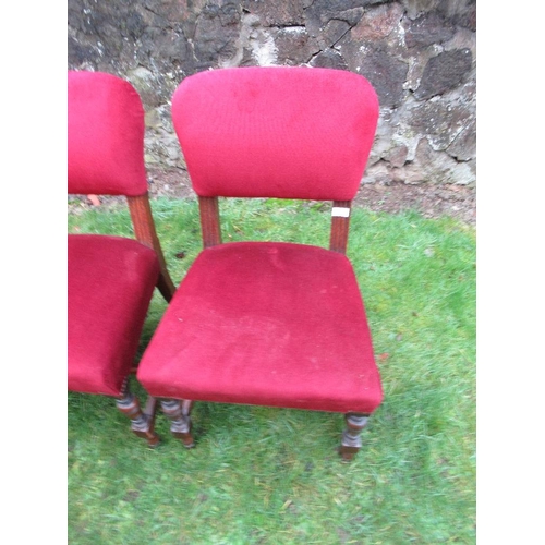 28 - A set of four dining chairs, with red upholstery