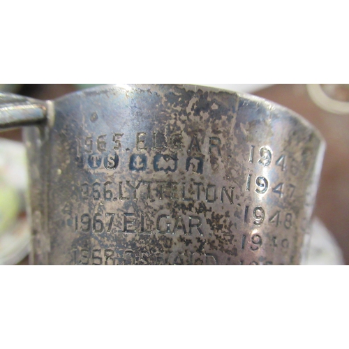 288 - A small silver two handled Art Deco style cup, with inscriptions