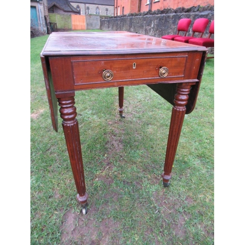 29 - A 19th century  Pembroke table, raised on reeded legs,