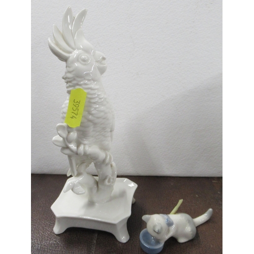 292 - A white model, height 7ins of a cockatoo, together with a Wade model of a cat drinking from a bowl