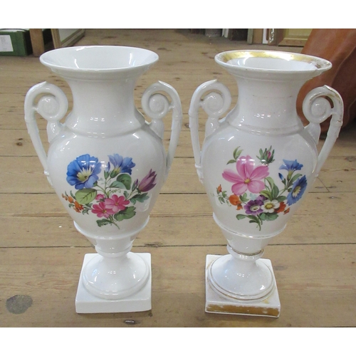 298A - A pair of continental  vases decorated with flowers having cross swords marked to the base, height 1... 