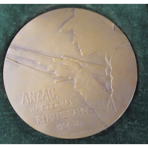 302 - A cased Anzac medal, together with a wooden cased knife