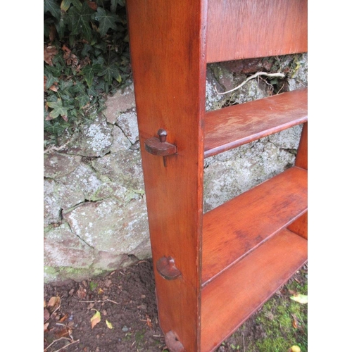 31 - An Arts and Crafts style set of shelves and a mahogany set