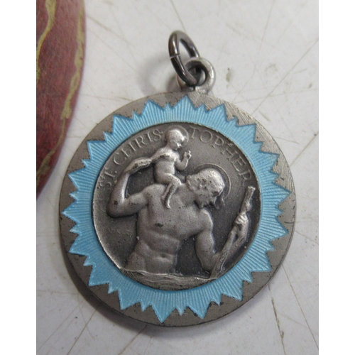 326 - A Sterling silver St Christopher pendant, together with a tooled leather oval box