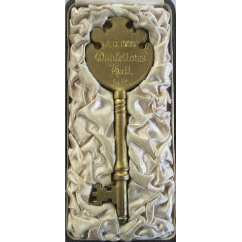 341 - A Masonic gilt metal key, engraved 'Old Fellows Hall AD 1900', in case