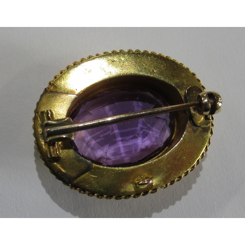 349 - A Victorian/Edwardian yellow gold brooch, with wirework detail, set single oval-cut amethyst