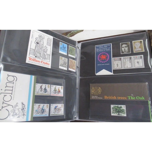 363 - An album containing Royal Mail First Day cover packs