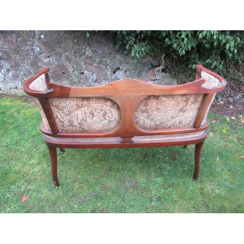 42 - An Edwardian salon settee, with inlaid decoration