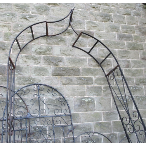 43 - Four metal garden gates and a metal arbor