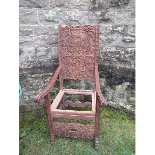 46 - A large heavily carved oak hall chair