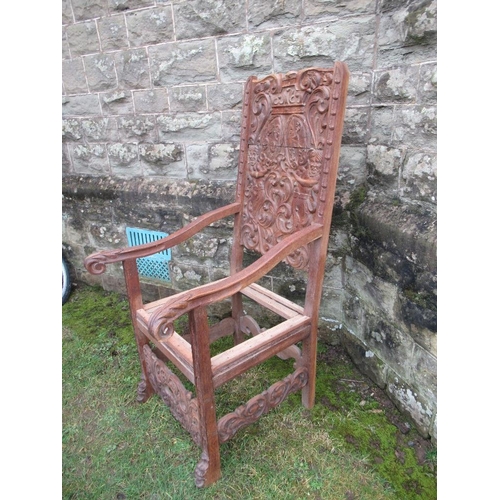 46 - A large heavily carved oak hall chair