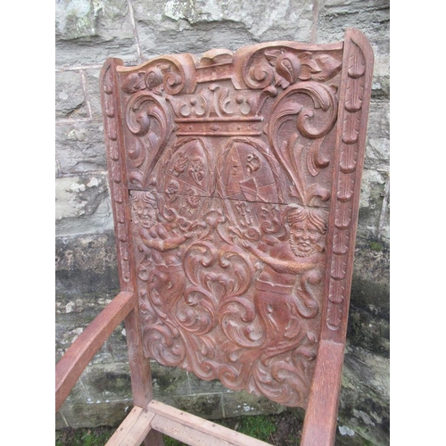 46 - A large heavily carved oak hall chair