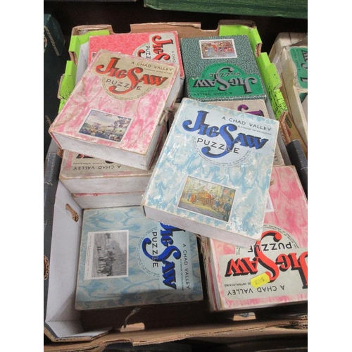 487 - Two boxes of vintage jigsaws, including Chad Valley