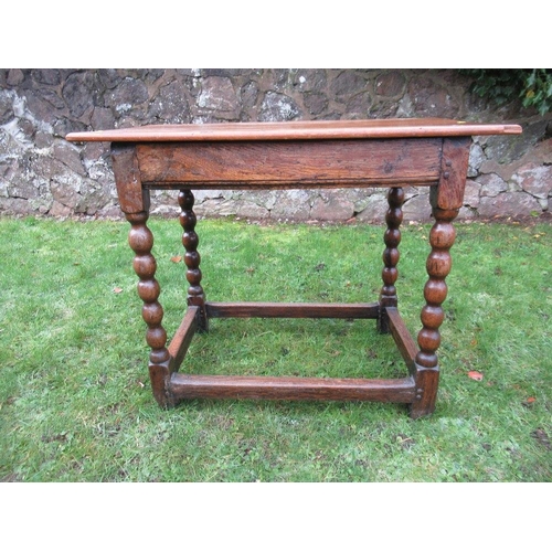 7 - An Antique oak side table, raised on bobbin turned legs united by stretchers, 18.25ins x 32.25ins, h... 