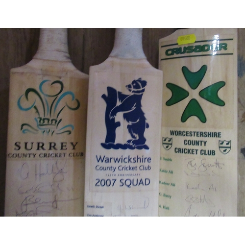 496 - Three County Cricket bats, signed