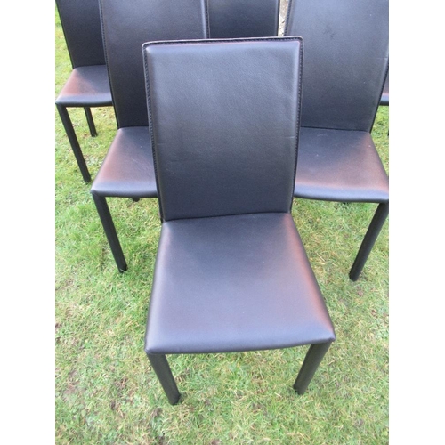 1 - A Set of six Heals leather dining chairs with Heals label to the base made in Italy and with fire la... 