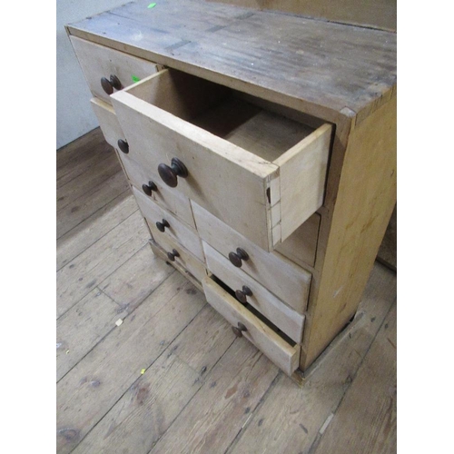 101 - A small chest of eight short drawers, width 24ins, depth 9ins, height 27ins