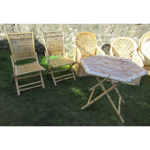 102 - A collection of bamboo conservatory furniture to include 3 chairs and a folding table