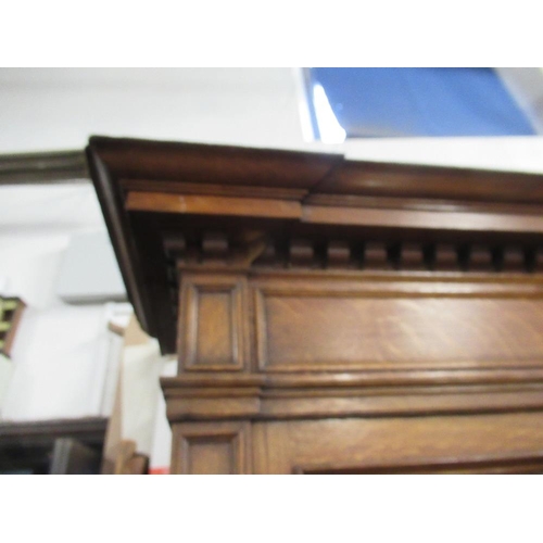 112 - A large 19th century oak cabinet the upper section having glazed lead doors opening to reveal shelve... 