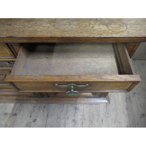 112 - A large 19th century oak cabinet the upper section having glazed lead doors opening to reveal shelve... 