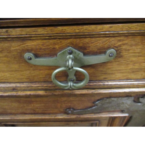 112 - A large 19th century oak cabinet the upper section having glazed lead doors opening to reveal shelve... 