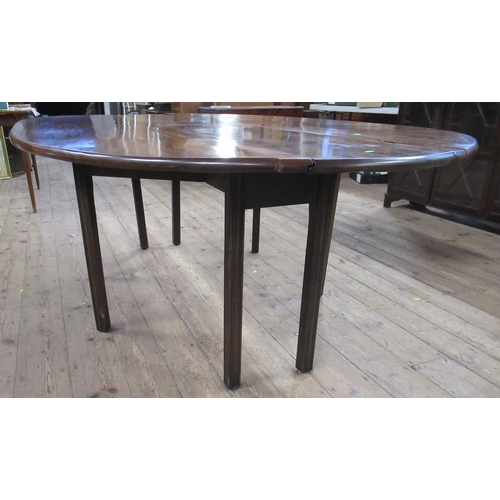 117 - A 19th century mahogany wake table, with double swing leg action and reeded legs, 88ins x 53.5ins, h... 