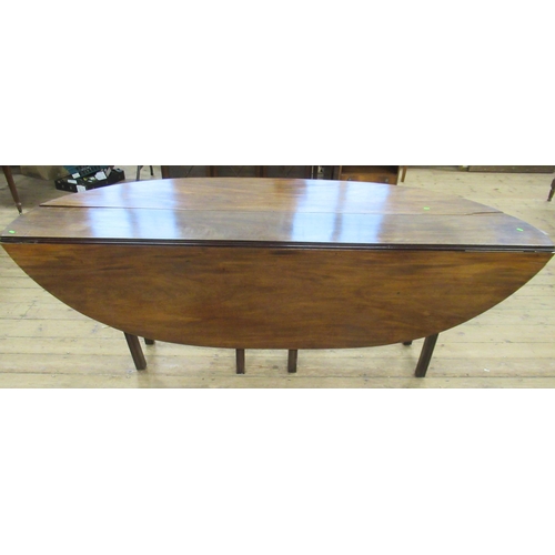 117 - A 19th century mahogany wake table, with double swing leg action and reeded legs, 88ins x 53.5ins, h... 