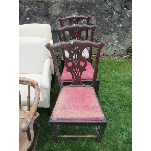 14 - A collection of chairs to include 3 Chippendale design chairs, a couple of upholstered arm chairs, t... 