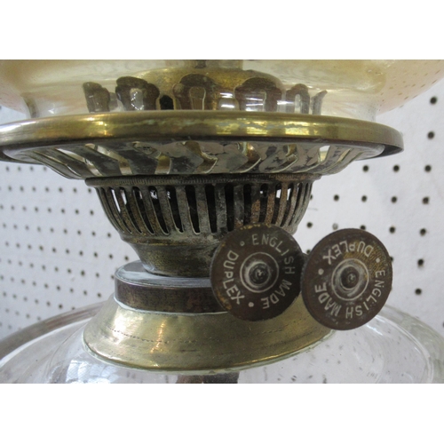 168 - An oil lamp, with brass column and glass shade