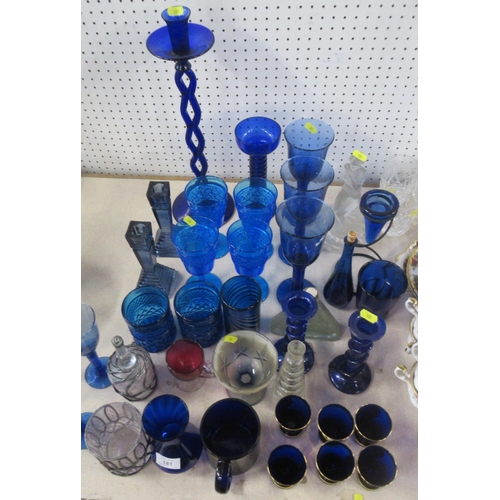 181 - A collection of blue glass including candle sticks