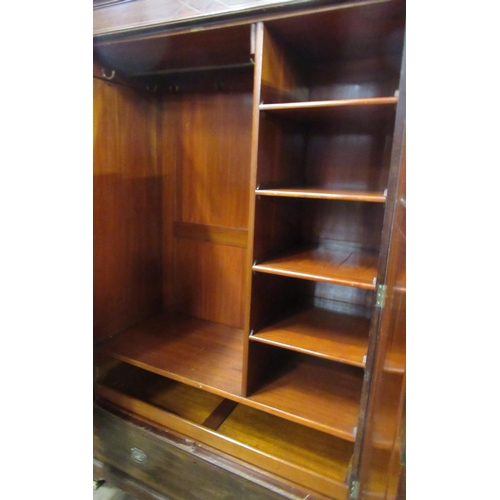 19 - An Edwardian mahogany wardrobe, with fitted interior, and drawer below, width 47ins, depth 22ins, he... 